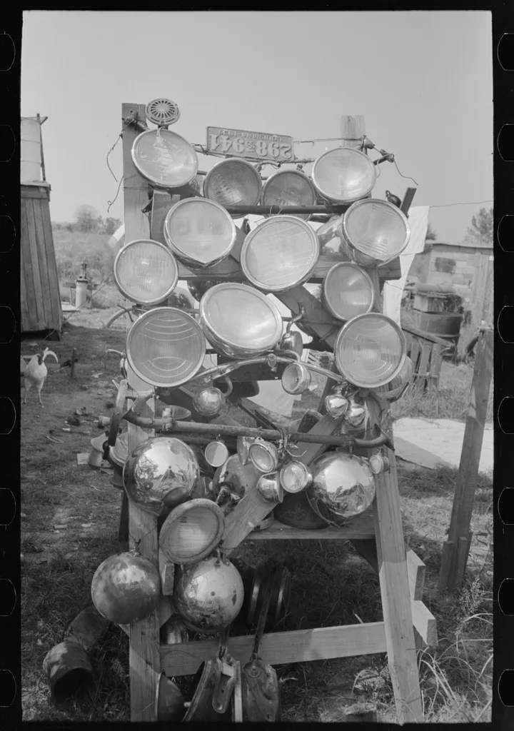 Display of headlights at junkyard, Abbeville, Louisiana, 1938