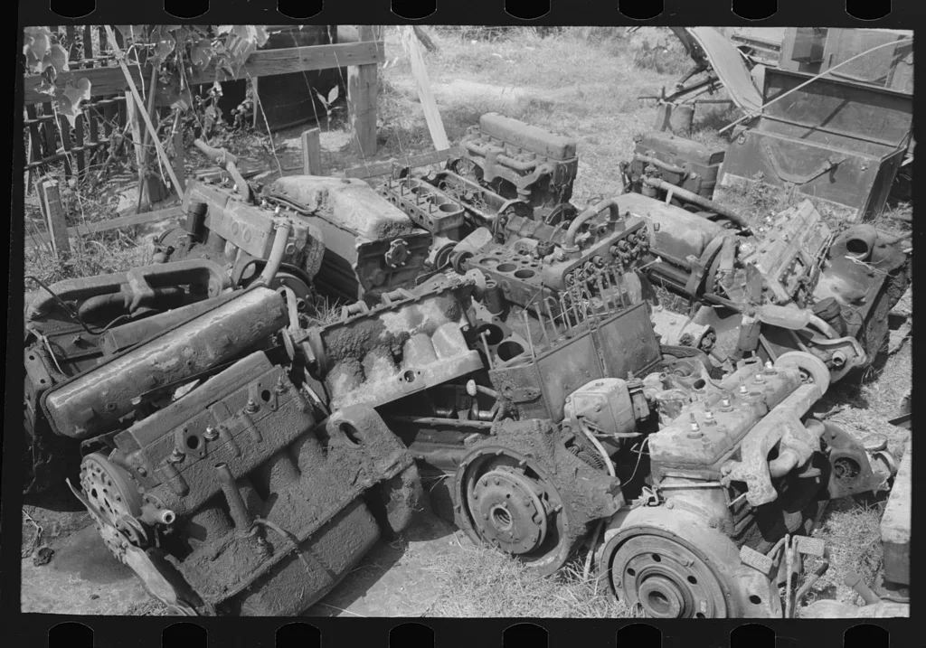 Discarded automobile motors at junkyard, Abbeville, Louisiana, 1938