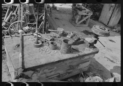 Workbench of junkyard owner, near Abbeville, Louisiana, 1938