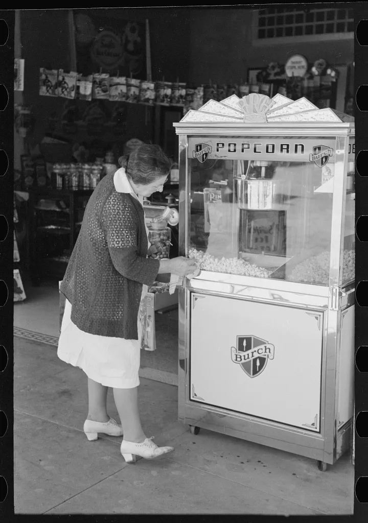 Women cleaning popcorn wagon, Taylor, Texas, 1939