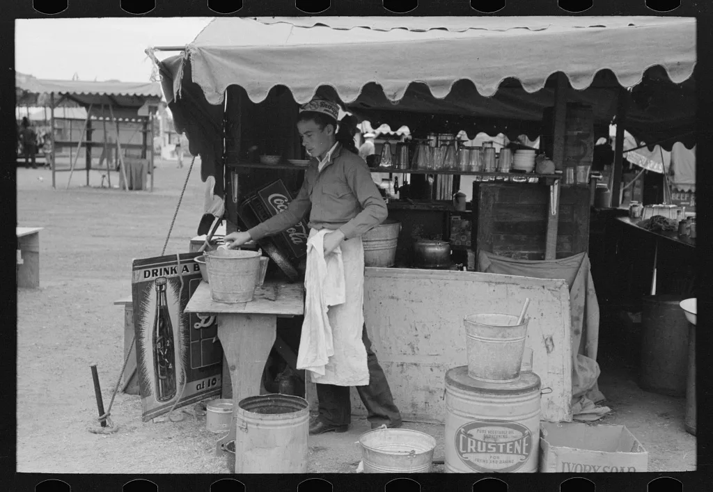 Dishwasher at hamburger stand, county fair, Gonzales, Texas, 1939
