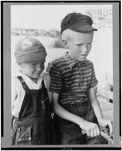 Sons of Mr. Leatherman in burro-drawn cart, Pie Town, New Mexico, 1940