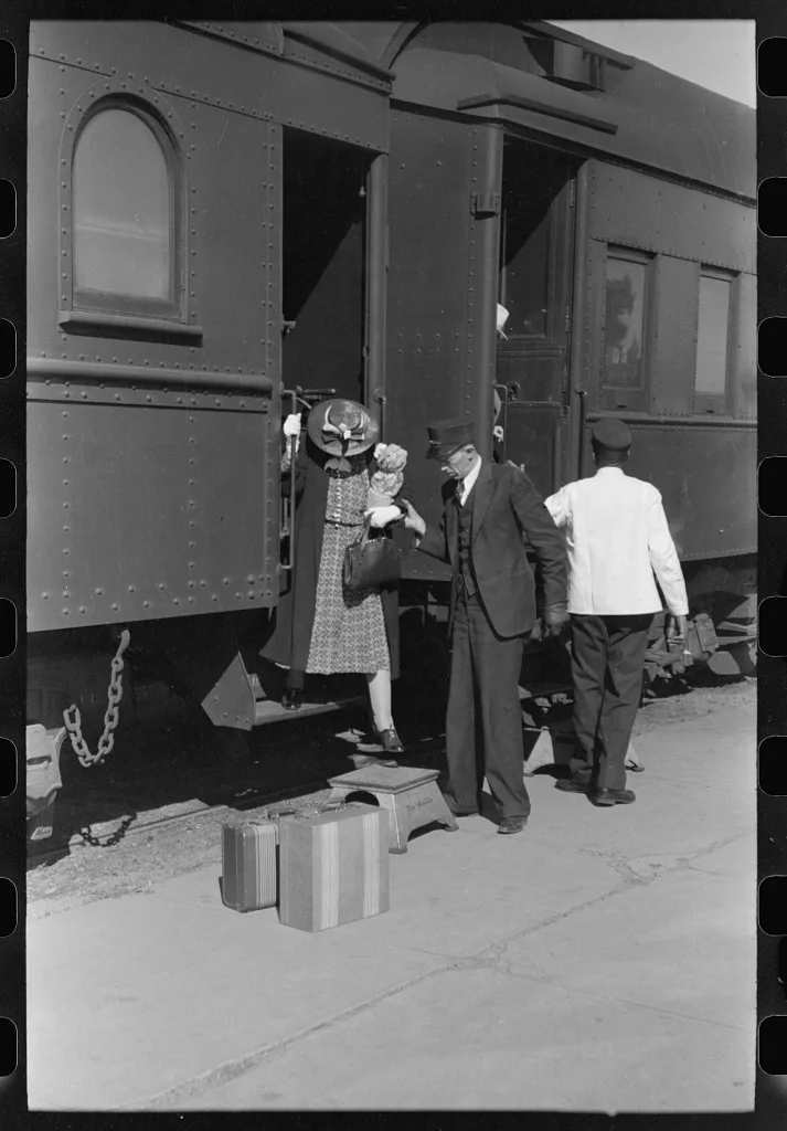 Passenger, alighting from morning train, Montrose, Colorado, 1940
