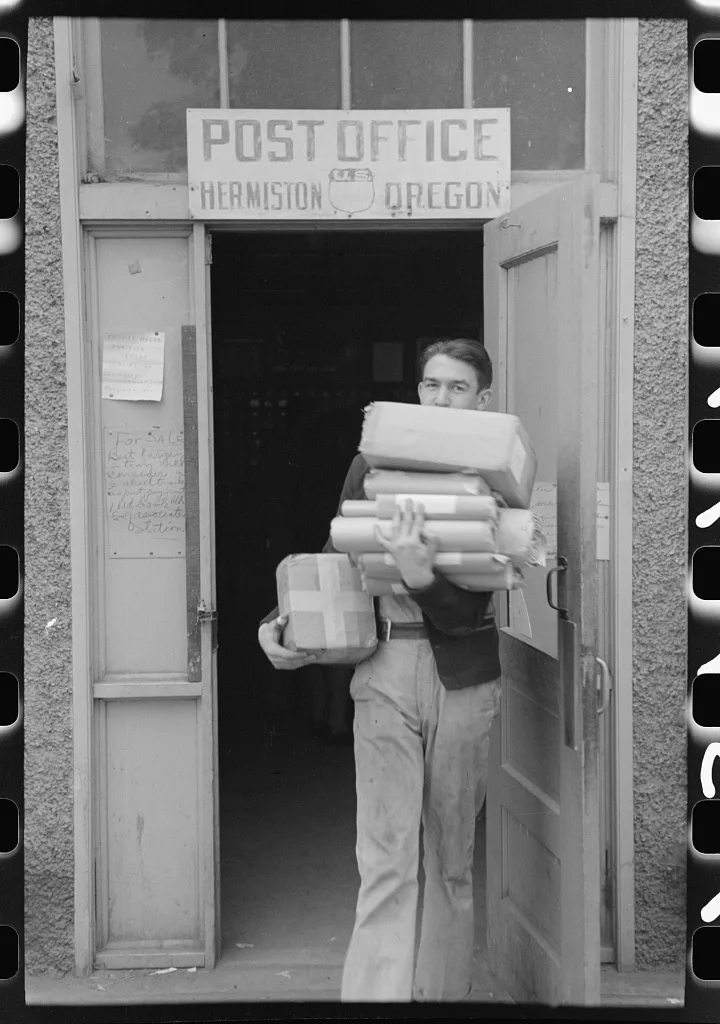 Coming out of post office at Hermiston, Oregon, 1941