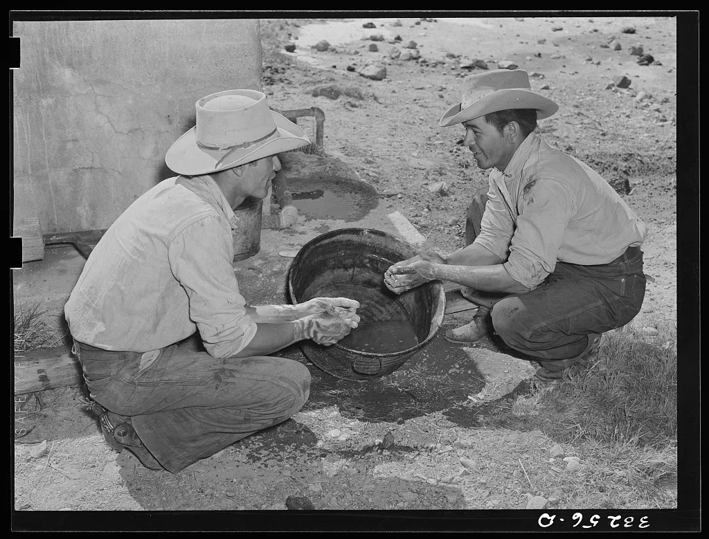 Mexican cowboys washing up after roundup. Cattle ranch near Marfa,…, 1939