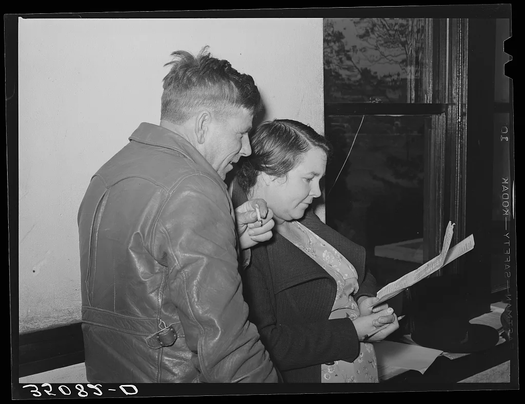 FSA (Farm Security Administration) client and his wife studying farm…, 1939
