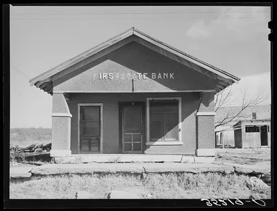 Deserted bank building in the oil ghost town of Slick, Oklahoma, 1940