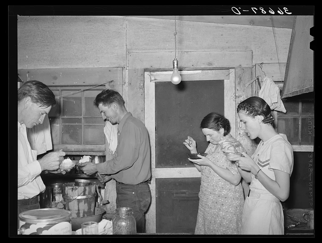 Farmers and their wives eating ice cream. Pie Town, New Mexico, 1940
