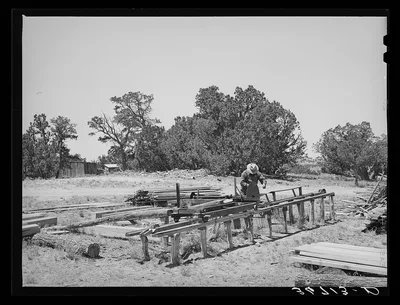 George Hutton working at the small sawmill which he built on his…, New Mexico, 1940