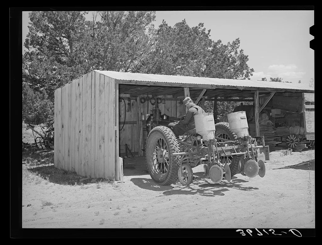 George Hutton with his tractor. He is one of the few farmers in this…, New Mexico, 1940