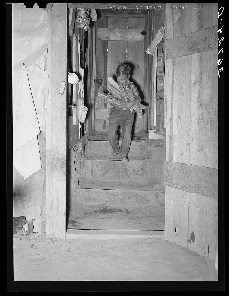 Jack Whinery's young son coming down the steps into the dugout with…, New Mexico, 1940