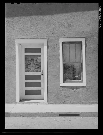 Door and window in Spanish-American home. Costilla, New Mexico, 1940