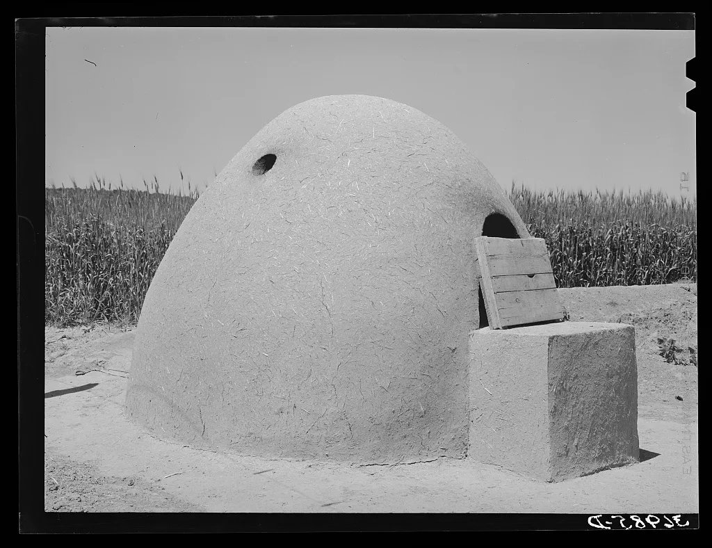 Outdoor adobe oven of Spanish-American family. Chamisal, New Mexico, 1940