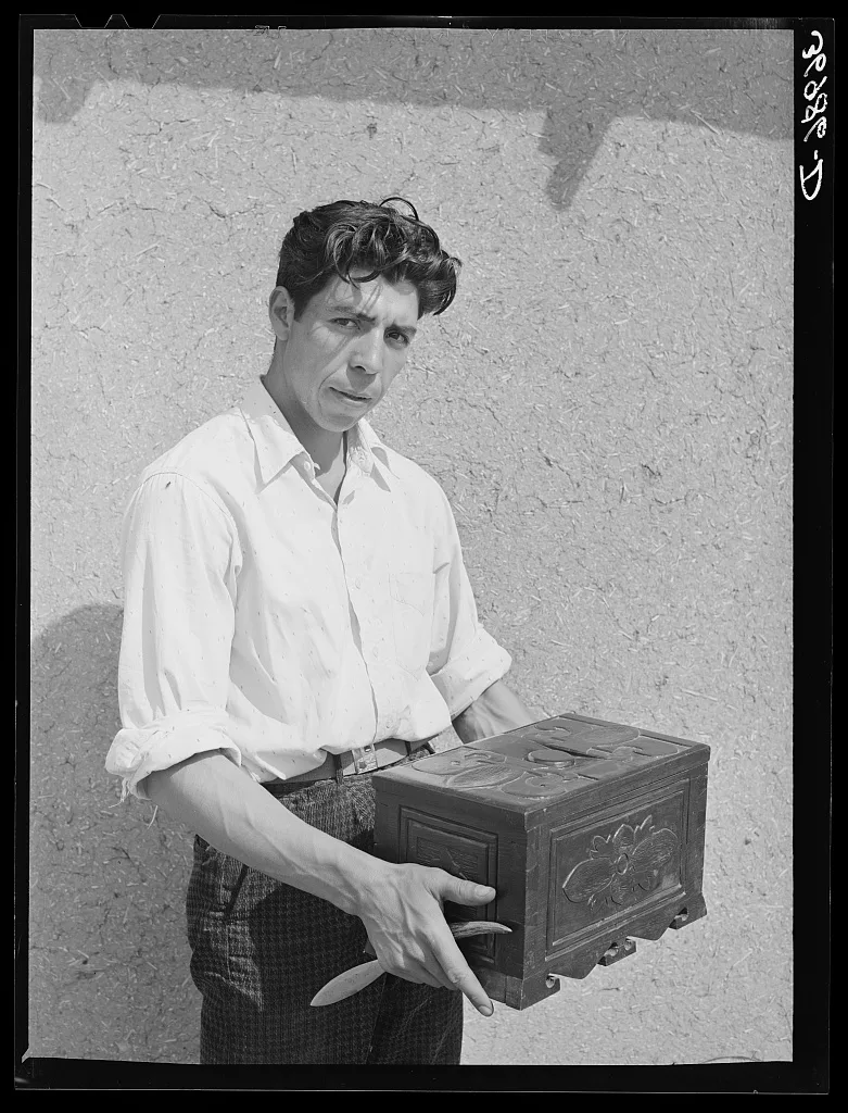 Spanish-American boy with chest which he carved. These people are…, New Mexico, 1940