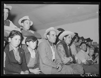 Audience of Spanish-Americans at traveling show. Penasco, New Mexico, 1940