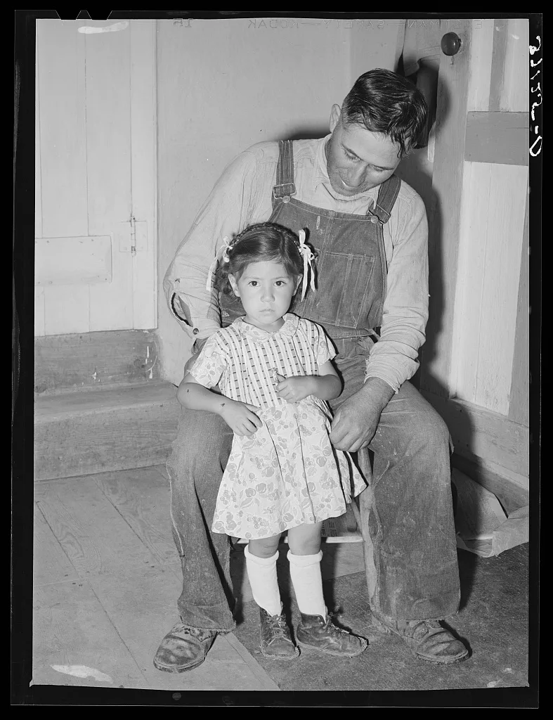 Spanish-American farmer with his daughter. Chamisal, New Mexico, 1940