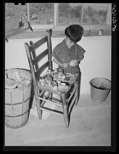 Spanish-American boy playing. Amalia, New Mexico, 1940