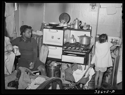 Kitchen in crowded Negro apartment. Chicago, Illinois, 1941