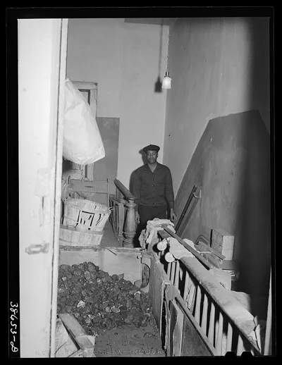 Coal storage in hall of apartment house rented to Negroes. Chicago,…, Illinois, 1941