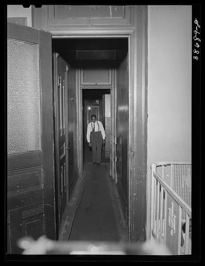 [Untitled photo, possibly related to: Hall leading to apartment of…, Illinois, 1941