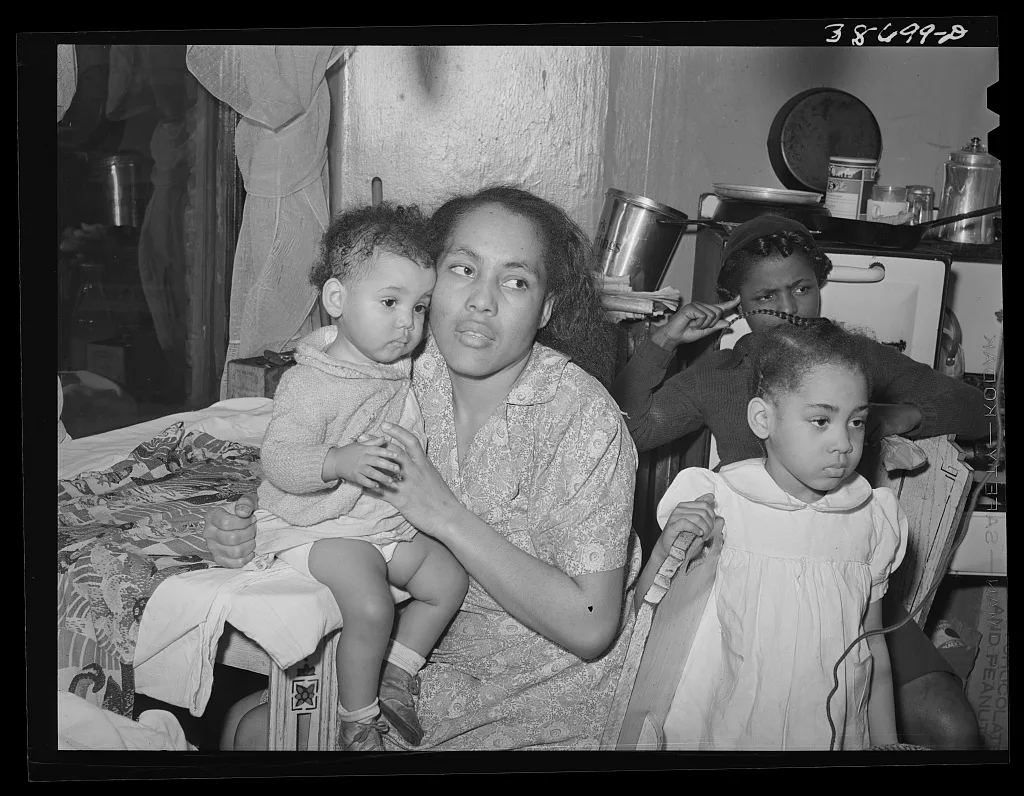 Mother and children at home. Chicago, Illinois, 1941