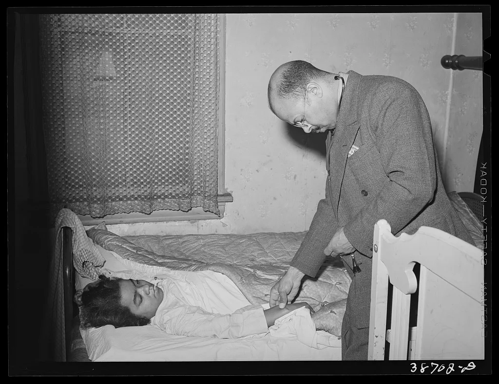 Doctor examining patient in her home. Family is on relief. Chicago,…, Illinois, 1941