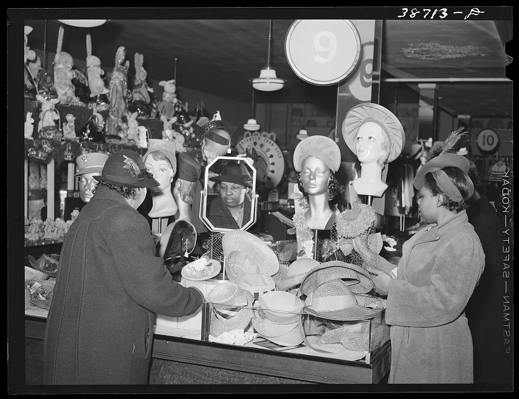 Buying hats in ten-cent store which caters to Negroes. Chicago,…, Illinois, 1941