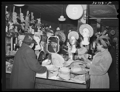 Buying hats in ten-cent store which caters to Negroes. Chicago,…, Illinois, 1941