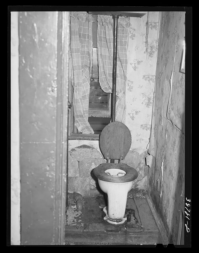 Toilet in home of family on relief. Chicago, Illinois, 1941