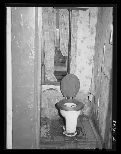 Toilet in home of family on relief. Chicago, Illinois, 1941