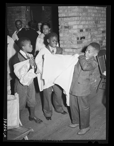 Boys of children's choir putting on their robes. Chicago, Illinois, 1941