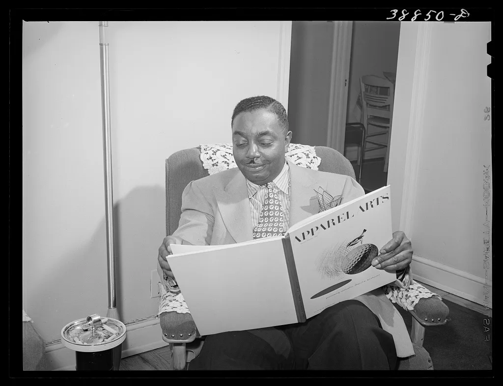 The best dressed Negro in Chicago, Illinois, spends an evening reading, 1941