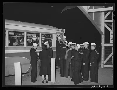 Sailors boarding a bus at Mission Beach, amusement center. San Diego,…, California, 1941