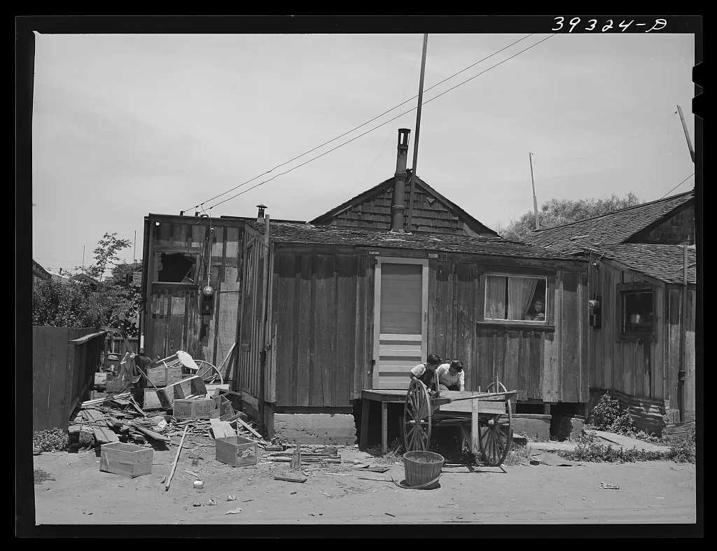 Two little Mexican boys playing in front of their home. San Diego,…, California, 1941