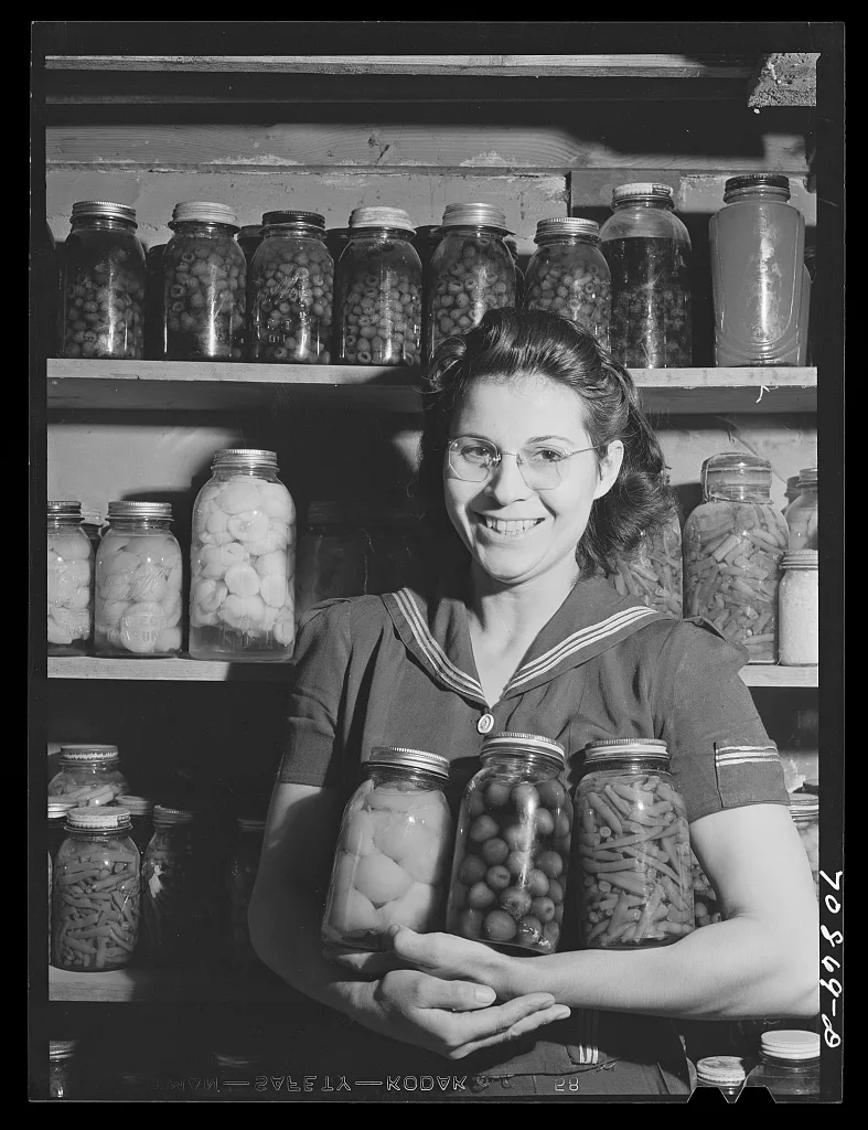 Mrs. Lee Wagoner with home canned fruits and vegetables. She and her…, Idaho, 1941