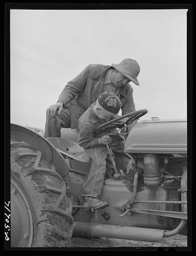 Tulare County, California. Farmer teaching his young son to drive the…, 1942